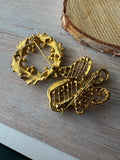 Pair of Gold Tone Holiday Brooches (A)