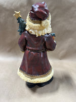 Santa Clause Holding Tree And Present Statue