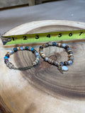 Pair of Bracelets with Feather Details