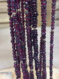Six Strands of Garnet & Gold Beaded Necklaces