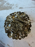Ornate Gold Tone Filigree Brooch with Black Lucite Cabochon