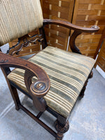 Antique Arm Chair with Carved Accents
