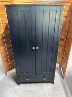 Black Particle Board Cabinet with Pumpkin Knobs