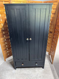 Black Particle Board Cabinet with Pumpkin Knobs