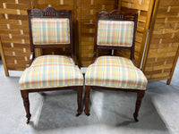 Pair of Antique Chairs with Front Casters and Plaid Fabric
