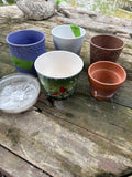 (G)Lot of Five Planters and Six 6” Plastic Saucers