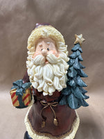 Santa Clause Holding Tree And Present Statue
