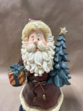 Santa Clause Holding Tree And Present Statue