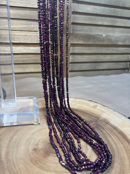 Six Strands of Garnet & Gold Beaded Necklaces