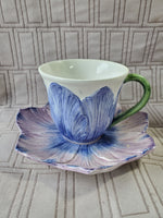 (A) Vietri Made in Italy Purple Flower Teacup and Saucer Set