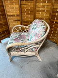 Wicker Chair and Ottoman with Floral Cushions