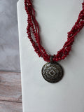 Red Beaded Torsade Necklace with Bronze Tone Filigree Pendant