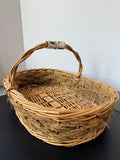 Oval Woven Wicker & Straw Hand Basket with Poinsettia Porcelain Handle