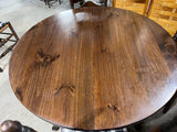 Round Table with (2) Leaves and (4) Ladder Back Chairs, with Plaid Seat Cushions.