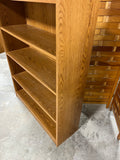 Oak Tone Particle Board Bookcase, Cardboard Backing