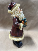 Santa Clause Holding Tree And Present Statue