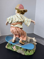 Boy on Skateboard with Dog Resin Garden Sculpture