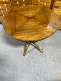 Round Wooden Occasional Table with Mid Century Flair