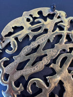 (A) Virginia Metalcrafters 1950 Brass Colonial Williamsurg Cypher Trivet