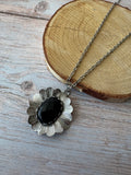 Silver Tone Textured Flower Pendant Necklace with Black Stone