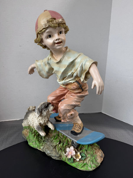 Boy on Skateboard with Dog Resin Garden Sculpture