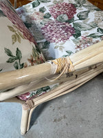 Wicker Chair and Ottoman with Floral Cushions