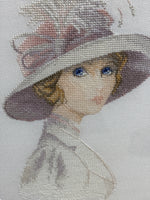 Cross Stitched Portrait of Woman in Hat