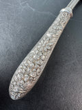 Floral Embossed Repoussé Slotted Spoon with Sterling Silver Handle
