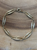 Gold Tone Swirl Bracelet