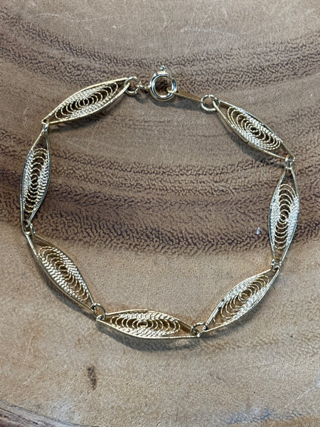 Gold Tone Swirl Bracelet