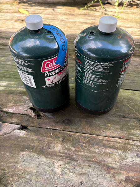 Two Coleman Propane Cannisters
