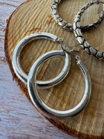 (D) Pair of Silver Tone Earrings