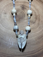 Beaded Necklace with Carved Pendant