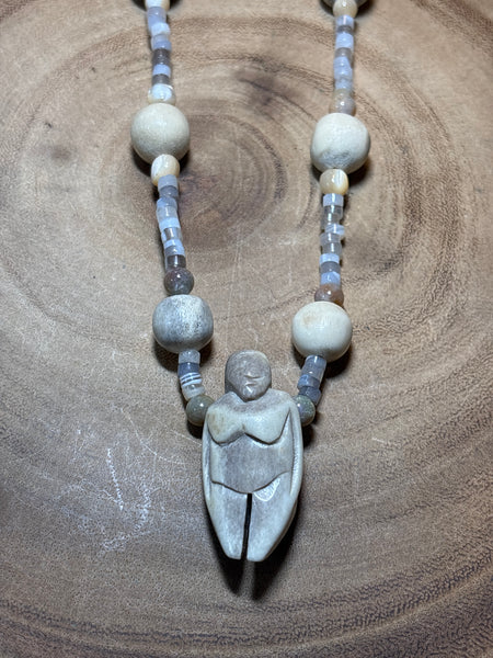 Beaded Necklace with Carved Pendant