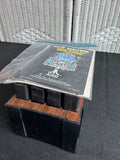 Lot of 8 Assorted Atari 2600 & 7800 Games with Manuals in 8-Cartridge Musicmate Modular Storage Rack (A)