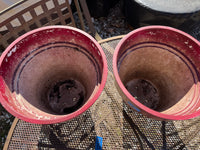 A-Pair of Red Plastic Planters