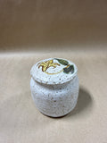 Speckled Pottery Jar With Floral Lid