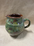 Green And Brown Glazed Pottery Pitcher — Signed At Bottom
