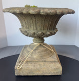 Ornate Stone Urn with River Rocks & Faux Moss