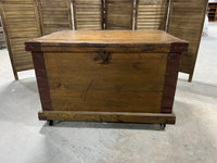 Antique Wooden Trunk with Metal Accents on Casters