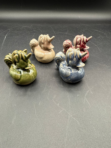 Lot Of 4 Glazed Pottery Unicorn Ducks