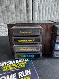 Lot of 8 Assorted Atari 2600 & 7800 Games with Manuals in 8-Cartridge Musicmate Modular Storage Rack (A)