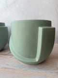 Pair of World Market Matte Sage Green Sculptural Ceramic Planters