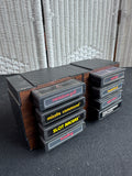 Lot of 8 Assorted Atari 2600 & 7800 Games with Manuals in 8-Cartridge Musicmate Modular Storage Rack (B)