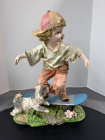 Boy on Skateboard with Dog Resin Garden Sculpture