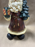 Santa Clause Holding Tree And Present Statue