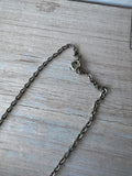 Cross Pendent Necklace with Inset Green Stones