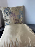 Pair of Champagne Throw Pillows with Multicolored Dandelions