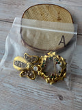 Pair of Gold Tone Holiday Brooches (A)