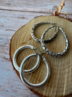(D) Pair of Silver Tone Earrings